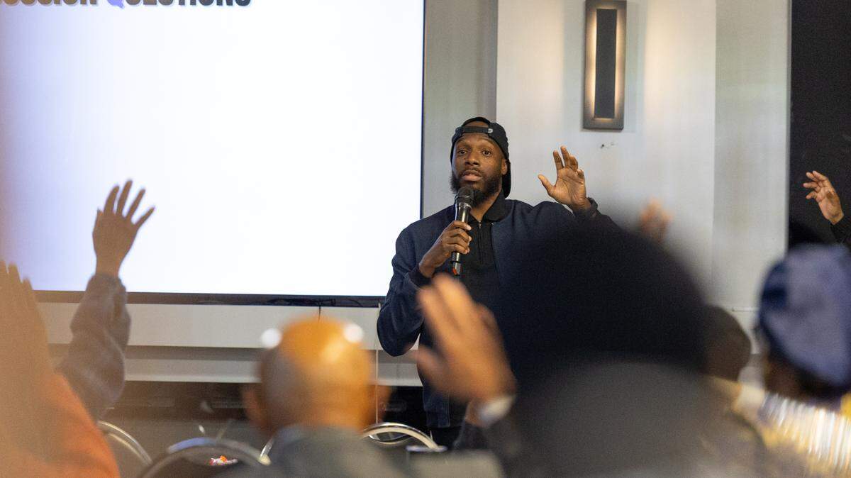 Aswad Thomas, a survivor of gun violence and National Director of Crime Survivors for Safety and Justice, asks members of the audience to raise their hands if they’ve been affected by violent crime.
