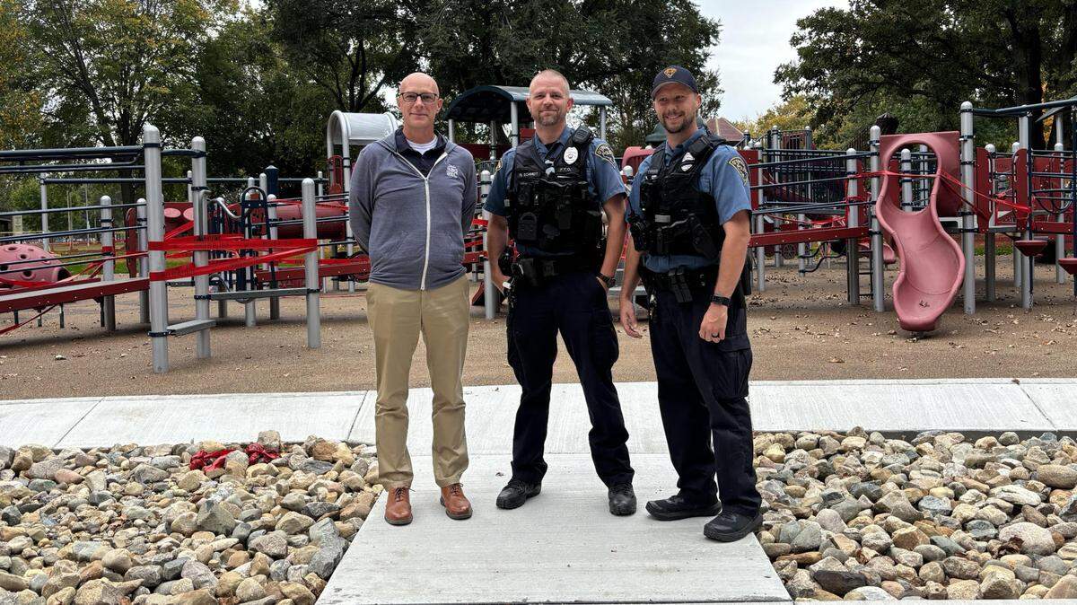 Andrew Dallner, director of O’Fallon Parks and Recreation, joins O’Fallon police officers Nick Schmidt and Mike Shewmaker, who work with Special Olympics, at the All-Abilities Playground that will have its grand opening Monday, Oct 30 at 4:30 p.m.