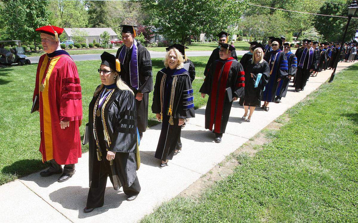 McKendree University President James Dennis leads a graduation procession in 2014. He estimates 17,000 students have received diplomas during his 25-year tenure.