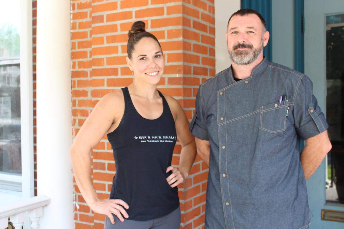Kristine Overacker, left, is the owner of Ruck Sack Meals in Highland. She hired her ex-husband, Chase Overacker, because “he’s the best chef I know,” she said.