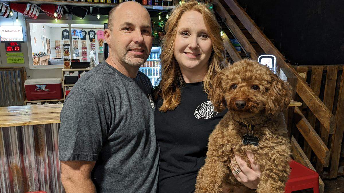 Sure Shot owners Tony and Jamie Barrale and their dog, George