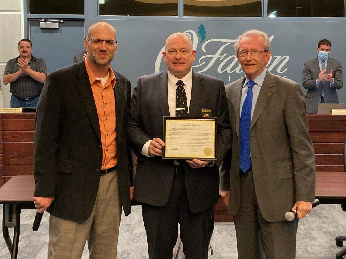 Retiring Police Chief Eric Van Hook, center, was honored at the Nov. 1 O’Fallon City Council meeting with a plaque and proclamation. City Administrator Walter Denton, left, pointed out Van Hook’s invaluable leadership qualities and Mayor Herb Roach, right, spoke of Van Hook’s innovations as director of public safety for the past eight years. Van Hook thanked the public works and city’s leadership teams for their efforts and hard work, and his wife, Laura, for her steadfast support. He received two standing ovations during the recognition.