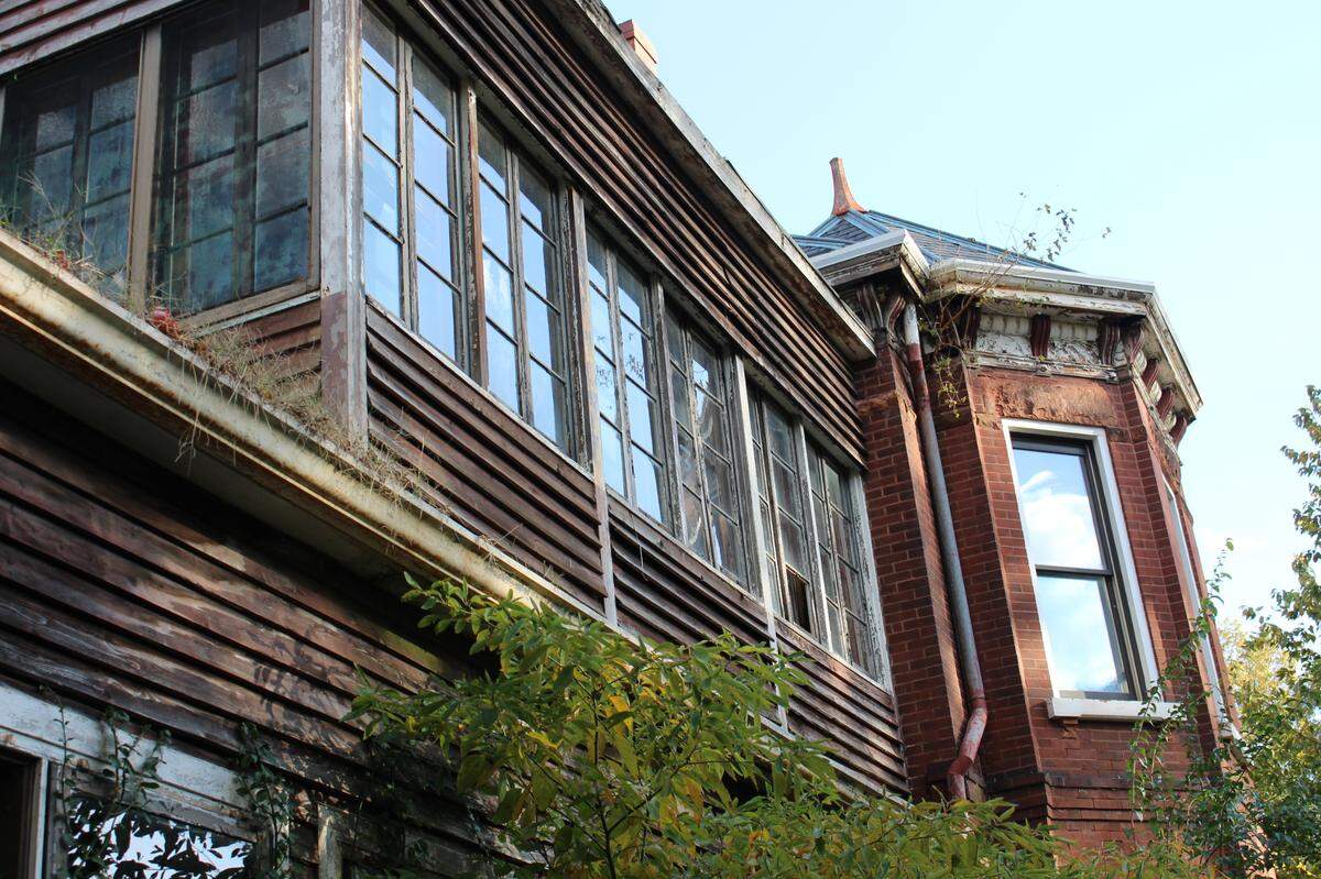 Broken windows and weeds growing out of gutters are among signs of neglect on a historic home at 107 E. D St. near downtown Belleville.
