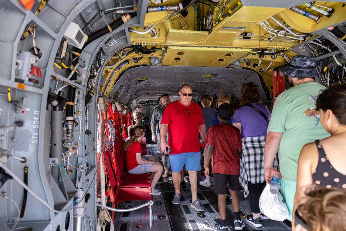 Attendees at the Scott Air Force Base Airshow get a peek inside the Chinook Helicopter on Saturday. The airshow drew thousands of spectators and included the MiG-17 Randy Ball; P-51 Mustang, Heritage Flight, F-22 Demo; Extreme Flight Pitts S1-S; and more.