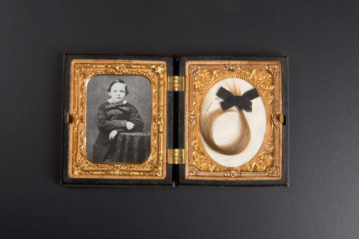 A photo of Willie Lincoln and a lock of his hair, one of 1,400 items in the Taper Collection. Willie died in the White House during Lincoln’s presidency.