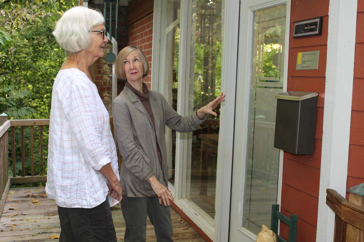 Margaret Meyer, right, Charles King adviser to Belleville Historical Society, talks to Belleville resident Betty Jones about the significance of her home, which was designed by King.