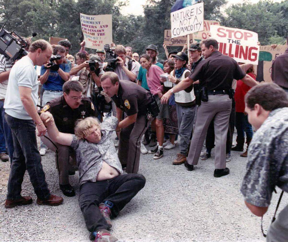 A protester is arrested during an anti-logging demonstration in the Shawnee National Forest in 1991.