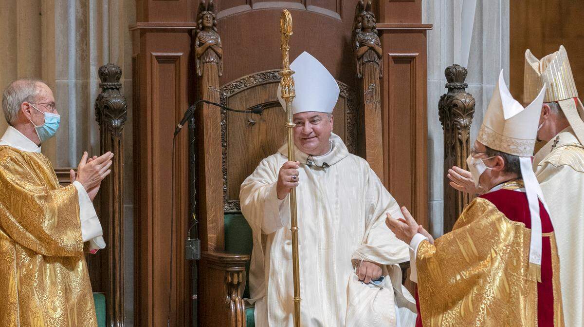 The Most Rev. Michael G. McGovern is congratulated after being ordained and installed as the ninth bishop of the Catholic Diocese of Belleville on Wednesday at the Cathedral of St. Peter in Belleville.