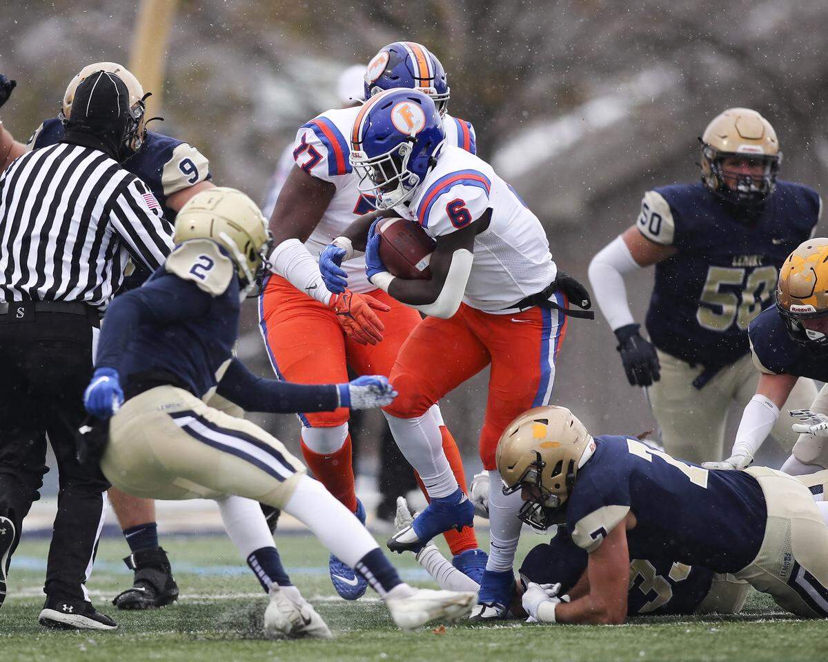 East St. Louis running-back TaRyan Martin carries the ball during the IHSA CLass 6A semifinals against Lemont. Martin’s 349 yards rushing and three touchdowns helped lead the Flyers to a 32-29 victory.