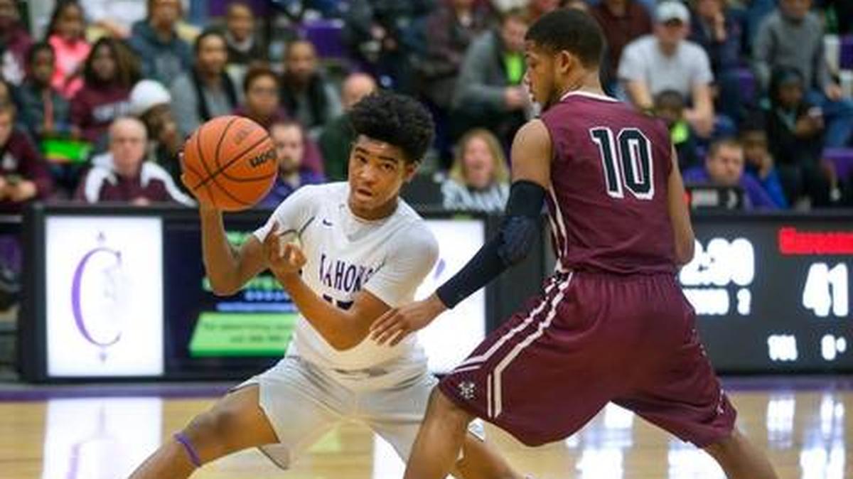 Collinsville’s Ray’Sean Taylor looks for an open man during a Southwestern Conference game against Belleville West at Collinsville High School last season.