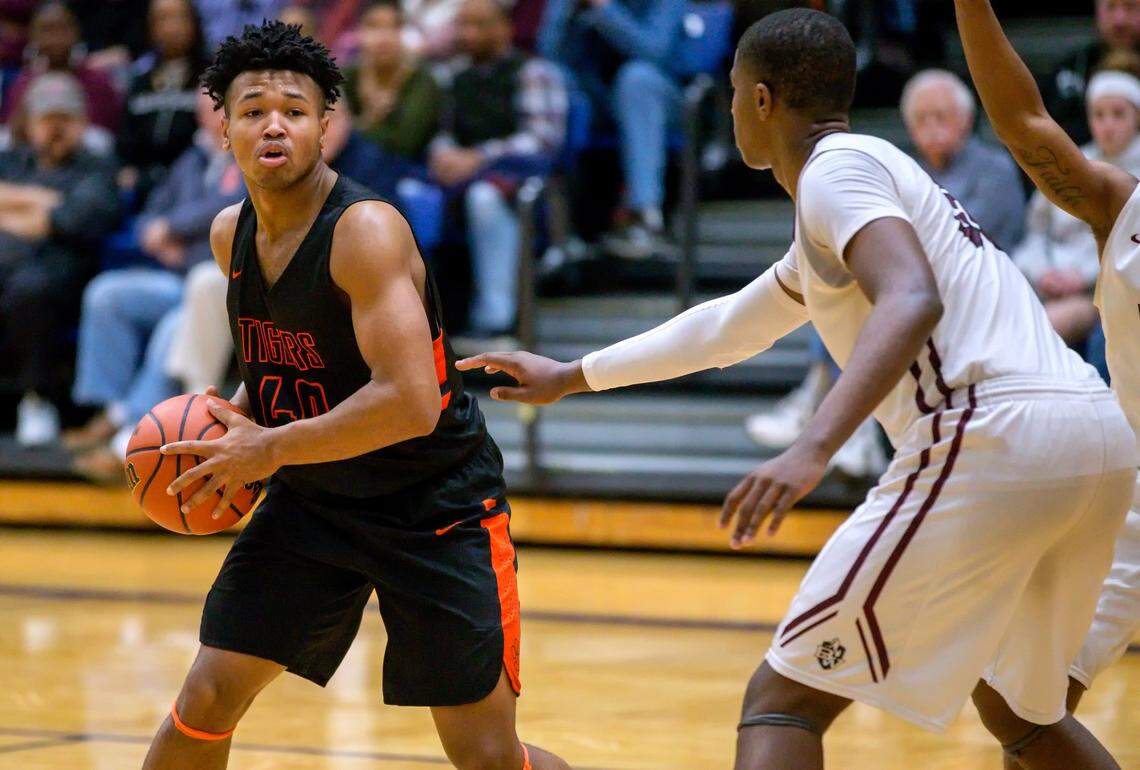 Edwardsville’s RJ Wilson looks for an open during Friday’s O’Fallon Class 4A IHSA Regional Championship game at OTHS’ Panther Dome.