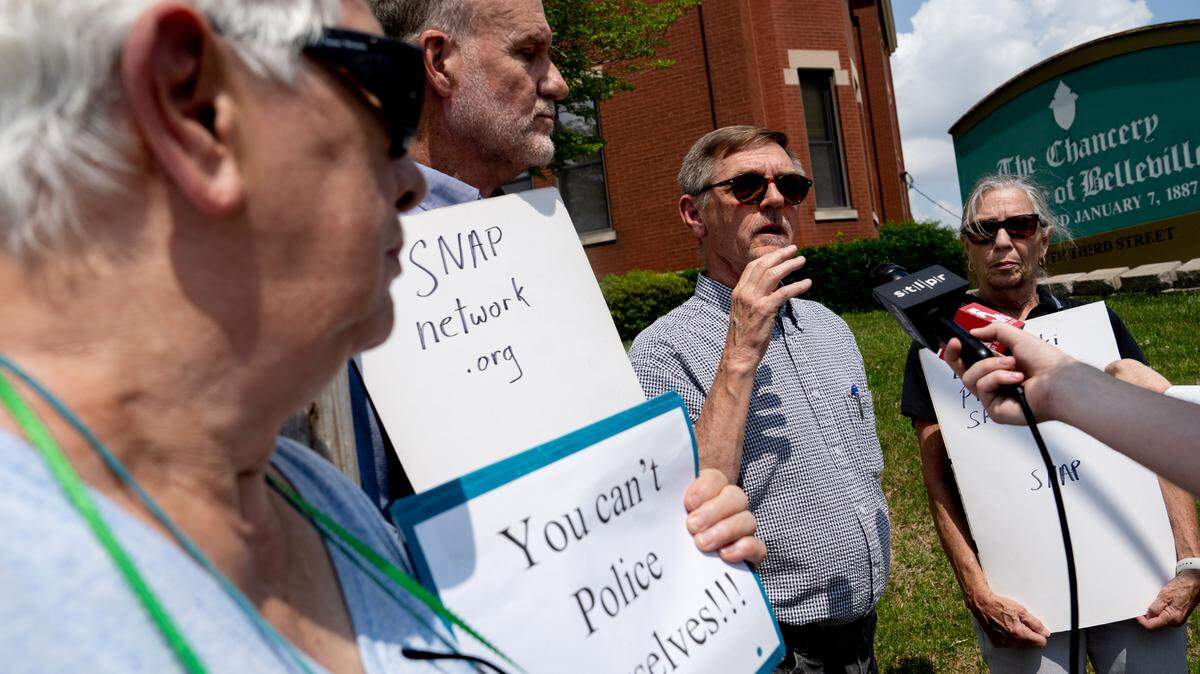 David Clohessy, of the Missouri chapter of the Survivors of those Abused by Priests, answers a reporter’s question during a press conference outside the Catholic Diocese of Belleville chancery last week.