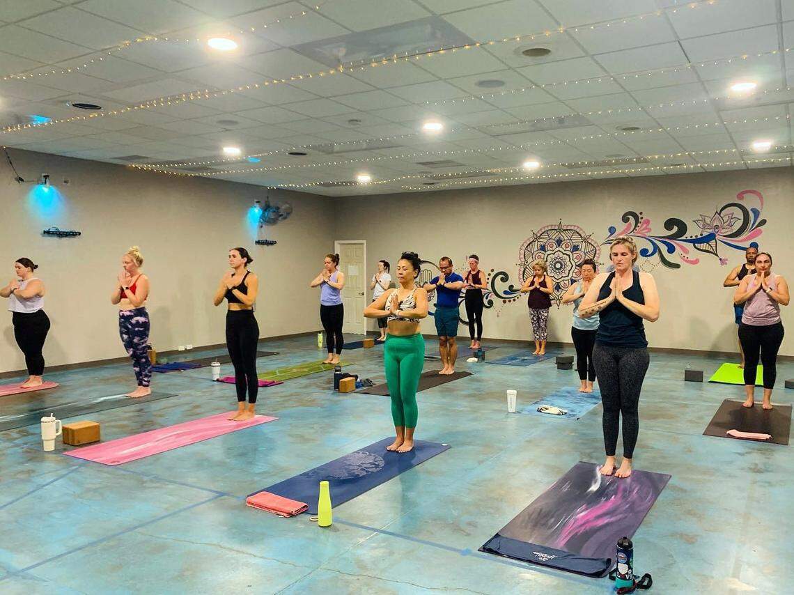 The studio at Go Yoga! Express can accommodate up to 60 students (five rows of 12), according to owner Kellie Mathes. This recent photo provided by Mathes shows a typical class at Go Yoga! Express.