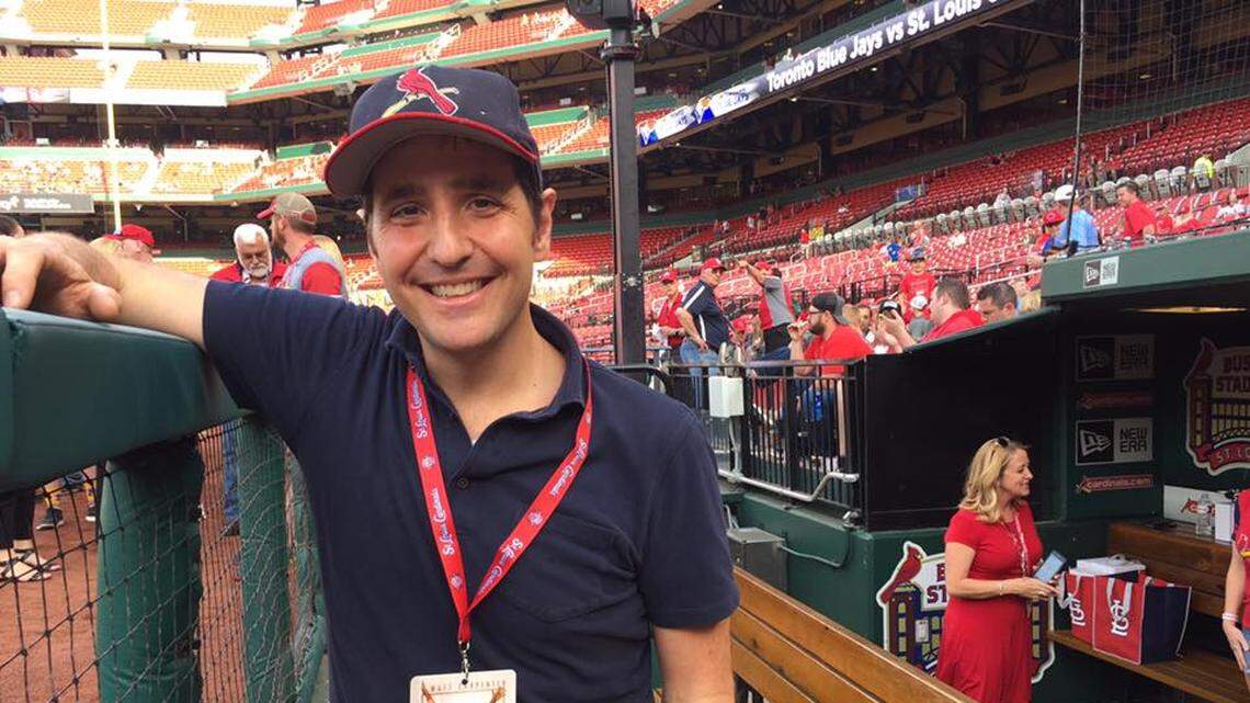 Edwardsville native A.J. Schnack stands in the St. Louis Cardinals dugout. Schnack has produced “Long Gone Summer,” which chronicles the 1998 home run record chase between Mark McGwire of the St. Louis Cardinals and Sammy Sosa of the Chicago Cubs. The documentary will air at 8 p.m. Sunday, June 14, on ESPN as part of its “30 for 30” series.