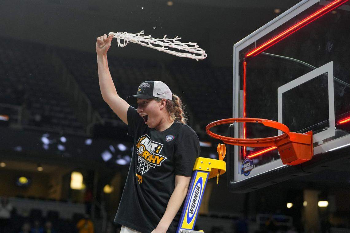 Apr 1, 2024; Albany, NY, USA; Iowa Hawkeyes guard Kate Martin (20) cuts the net after defeating the LSU Lady Tigers in the finals of the Albany Regional in the 2024 NCAA Tournament at MVP Arena. Mandatory Credit: Gregory Fisher-USA TODAY Sports