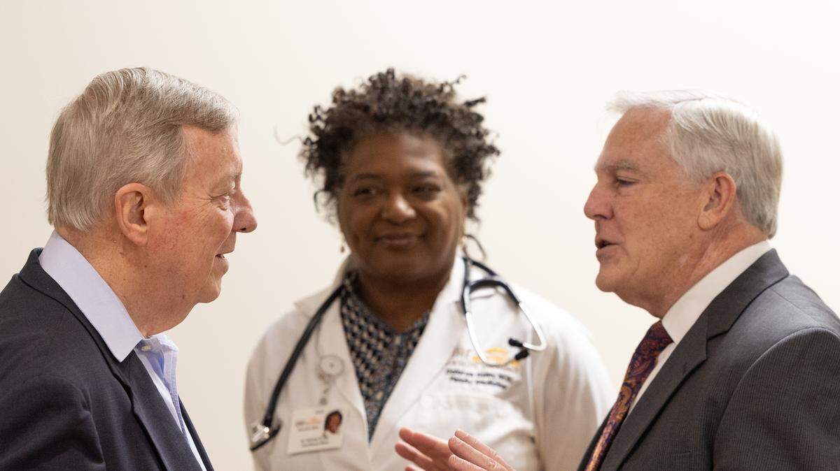 (Right to left) U.S. Senator Dick Durbin, Southern Illinois Healthcare Foundation (SIHF) chief medical officer Dolores Gunn, and SIHF president and CEO Larry McCulley speak together after a news conference addressing recent cuts to the Affordable Care Act and Medicaid.
