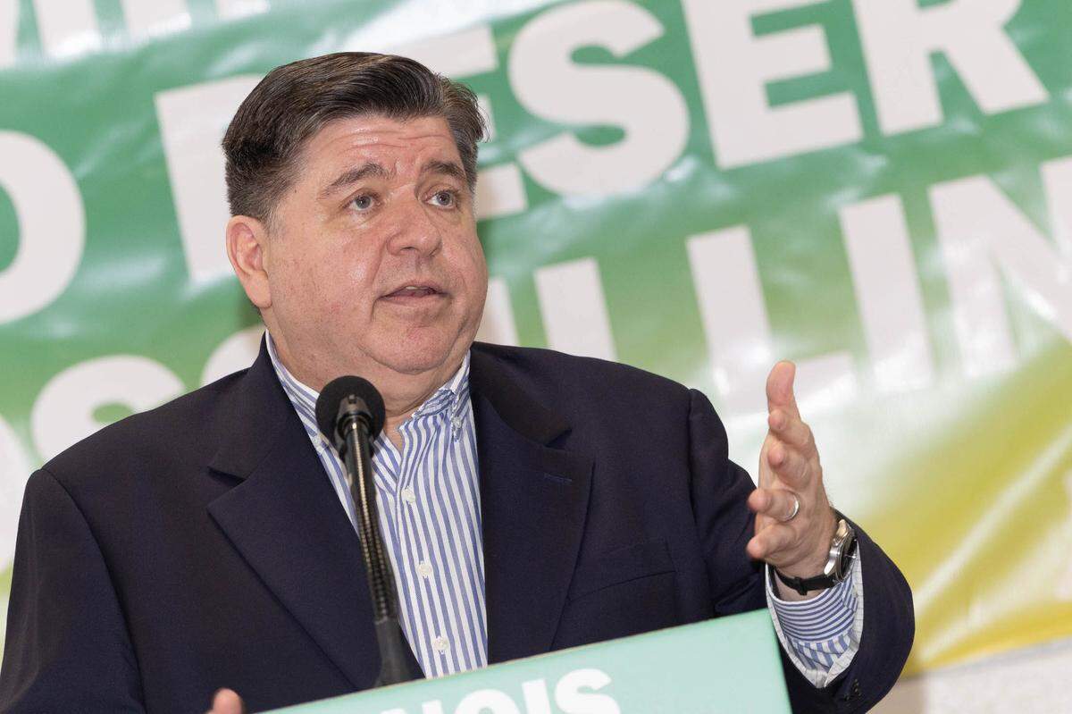 Ill. Gov. J.B. Pritzker addresses a crowd at the Venice Recreation Hall during a news conference for a grocery store groundbreaking in Venice, Ill. on May 15.