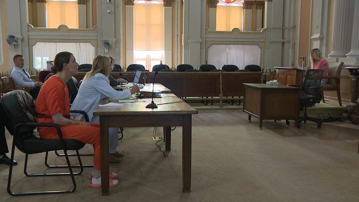 Ashley Bottoms, seated next to her attorney, public defender Anne Clough, listens as her mother Vicky Nichols testifies as a character witness at her sentencing hearing Monday.