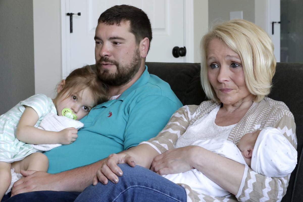George Goscinski, left, with daughter Joanna, and mother-in-law Janice Barts, holding newborn Hudson, talk about George's wife, Kayla, who died May 3 two days after giving birth.