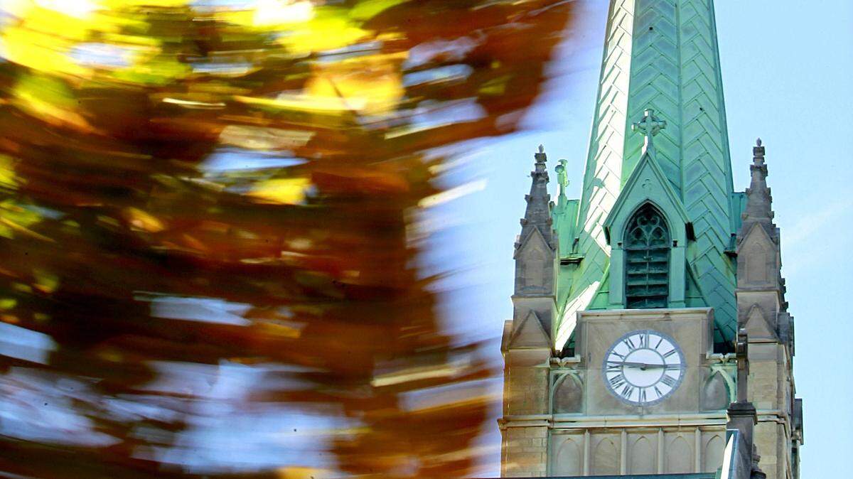 The wind blows fall leaves near St. Peter’s Catholic Cathedral in Belleville in this file photo. Here’s what to know about fall weather in Belleville and across Illinois, with forecast information from the National Weather Service plus a prediction from the popular Farmers’ Almanac.