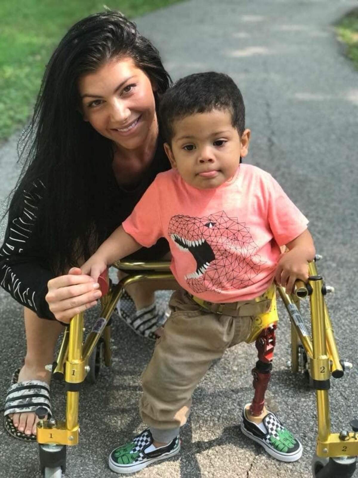 Brie Rainey with her 3-year-old son Josiah, whose left leg prosthetic was stolen from his mother’s car.