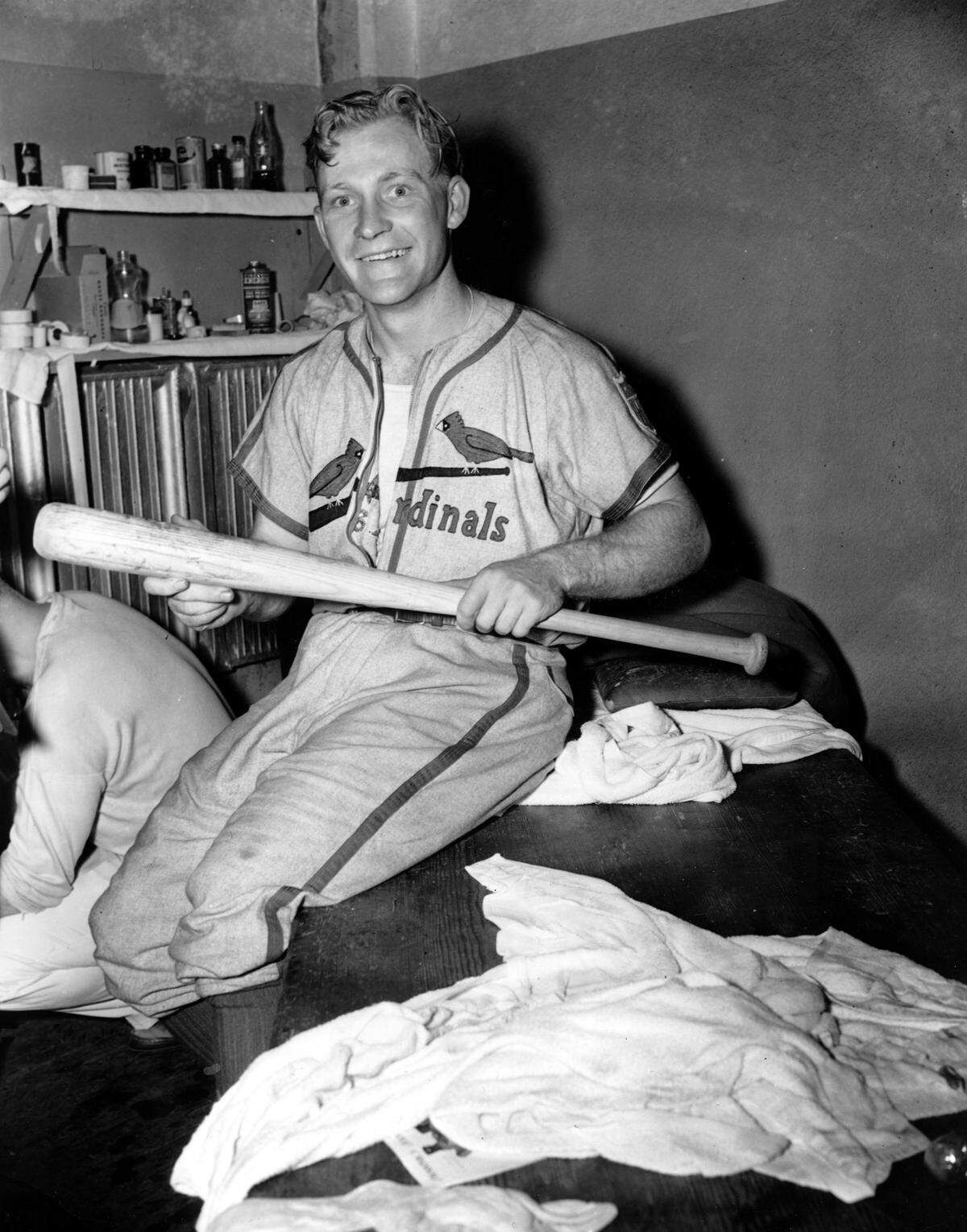 George “Whitey” Kurowski, St. Louis Cardinals third baseman, smiles as he holds the bat with which he won game five of the World Series at Yankee Stadium in New York City, Oct. 5. Whitey’s two-run homer in the ninth inning sent the Cardinals ahead of the Yankees, 4-2, and clinched the series championship.(AP Photo)