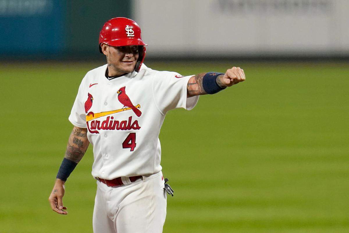 St. Louis Cardinals catcher Yadier Molina celebrates after hitting a single for his 2,000th career hit in 2020. A new tool called PitchCom that’s been touted by Major League Baseball as an exciting innovation and that’s been widely adopted by nearly half the teams in the big leagues is struggling to catch on in the Cardinals clubhouse, including from Molina and his backup, Andrew Knizer.