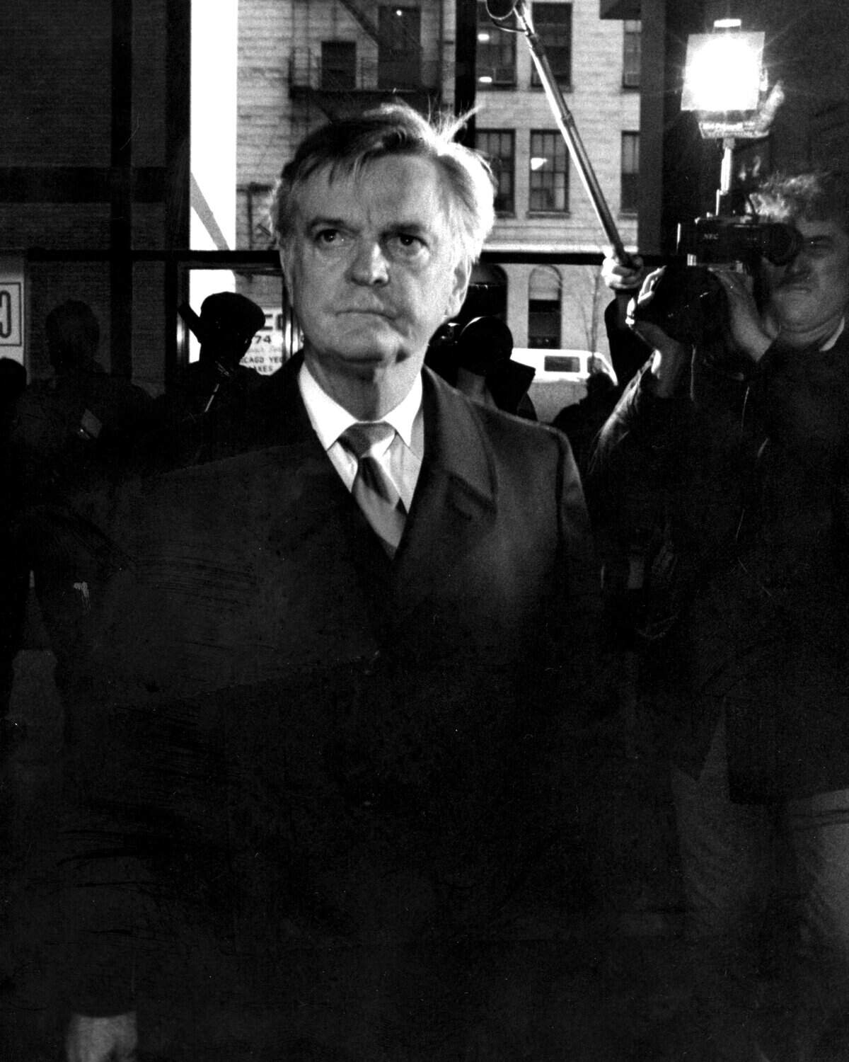 In this Nov. 20, 1987 photo, former Illinois Gov. Dan Walker arrives at the Federal Building in Chicago, where he was sentenced to seven years in prison after being convicted of misusing funds from his failed savings and loan association in Oak Brook, Ill.