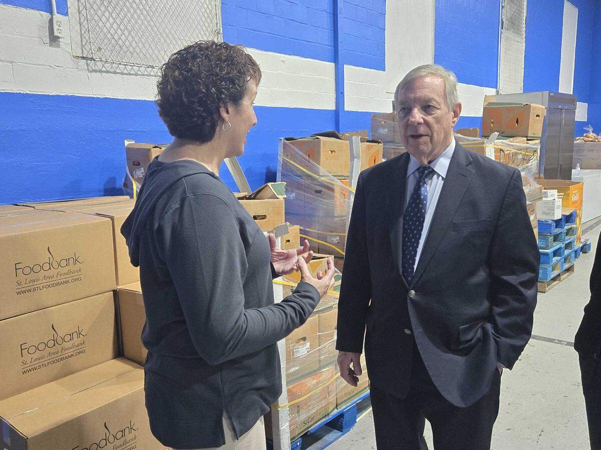 U.S. Sen Dick Durbin speaks with Meredith Knopp, president and CEO of the St. Louis Area Foodbank, at the Lessie Bates Davis Neighborhood House’s food pantry in East St. Louis on Monday.
