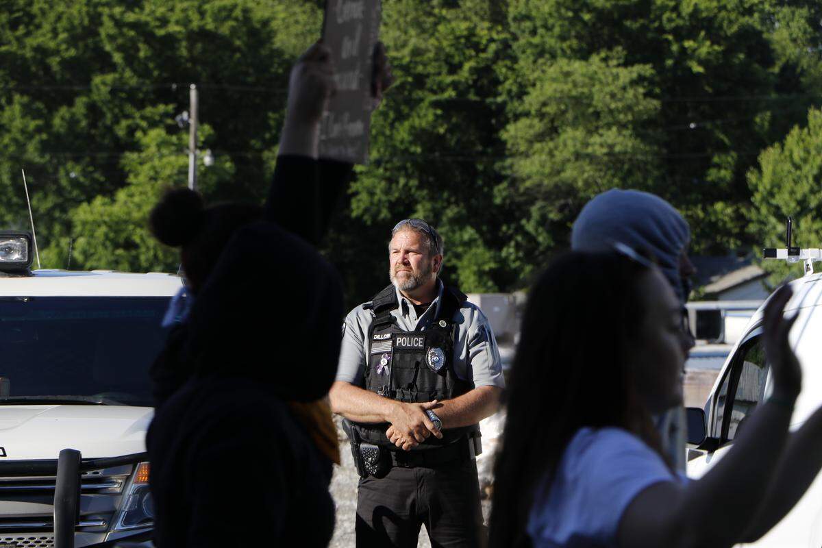 A police officer observes Black Lives Matters marchers in Anna on June 4, 2020. Police from multiple departments were crucial in keeping the peace between demonstrators and counter-protesters.