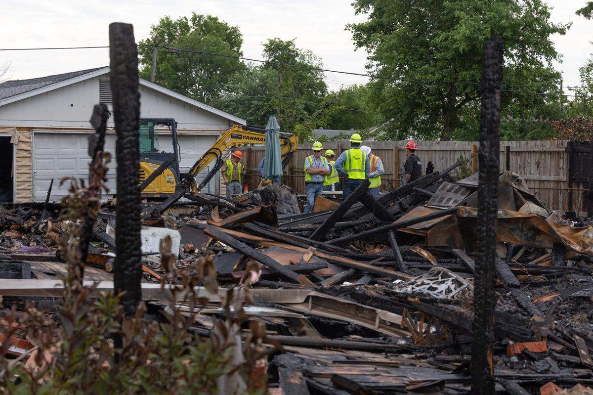 At the site of a house explosion outside of Collinsville on Monday.