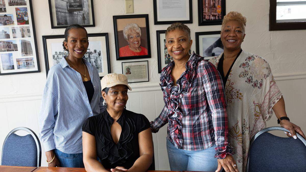 (L-R) Tiffany Robinson, Gina Miller-Jackson, Cheree Mimms and Karen Clay pose in front of a wall honoring the late Billie Jean Miller at Billie’s Pastries in East St. Louis, Ill. on March 5, 2024.