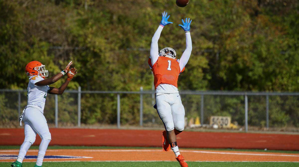 East St. Louis Lawaun Powell attempts to catch the ball during Saturday’s win over Morgan Park. The Class 6A top-seeded Flyers travel to Rock Island for a second round game next week.