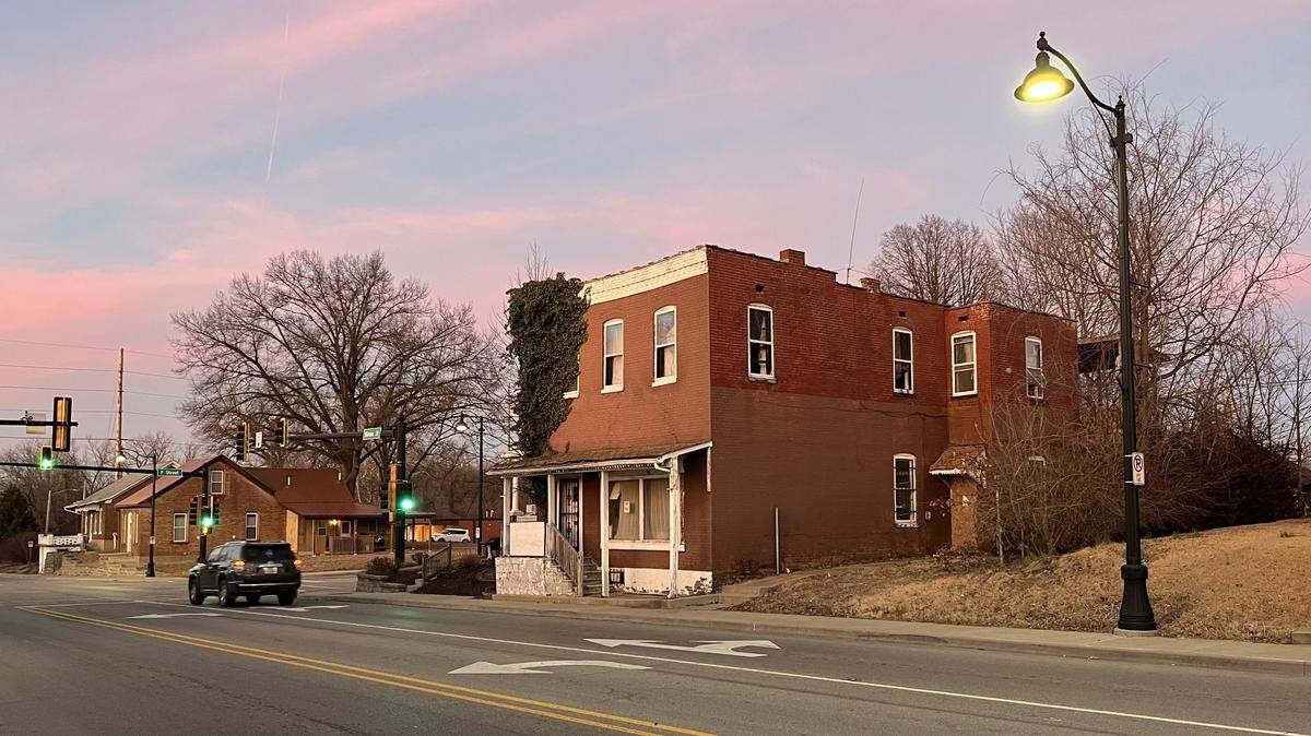 Squatters had been living in the two-story brick building at 520 N. Illinois St. in Belleville for about a year and a half before a homeless man was found dead in its garage last month.