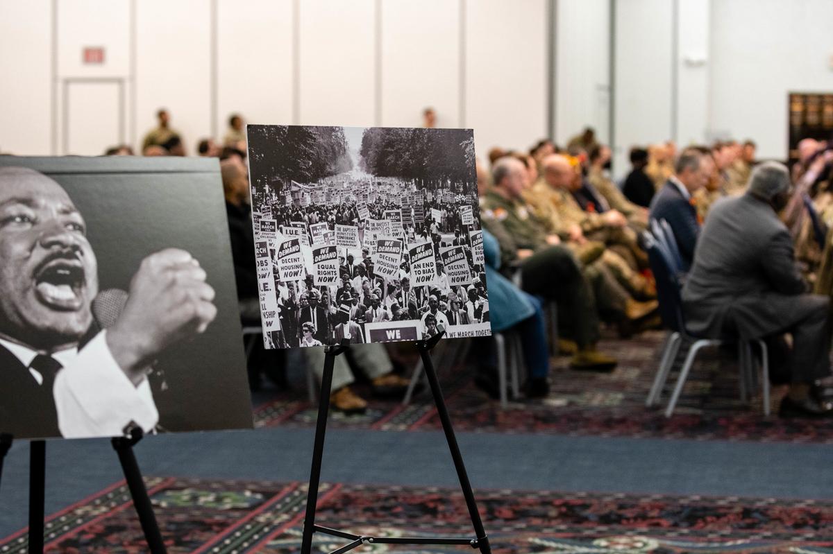 Photos from the civil rights era are placed for the audience to see during a “We” Have a Dream event Jan. 12 on Scott Air Force Base. The guest speaker, Reginald Petty, recounted moments of his life to inspire others to get more involved with one another.