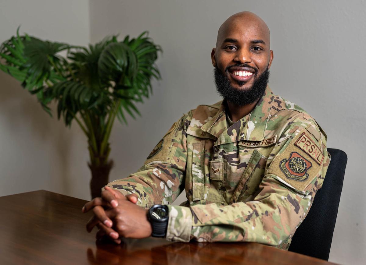 U.S. Air Force Airman 1st Class Salat Ali, 375th Force Support Squadron force support technician, poses for a photo on Scott Air Force Base. Ali was born in a Kenyan refugee camp and plans to become an immigration lawyer to help others who still live in the camp.