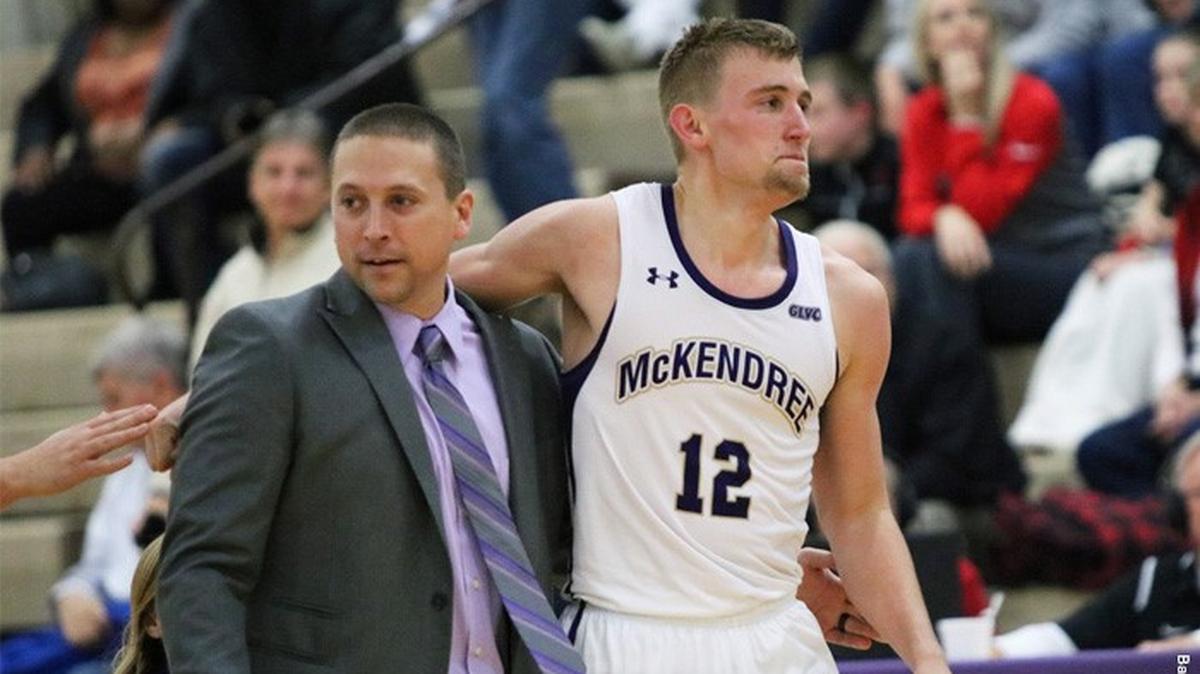 McKendree men’s basketball head coach Chris Foster and Nate Michael celebrate after McKendree wins its opening  game against Union University.