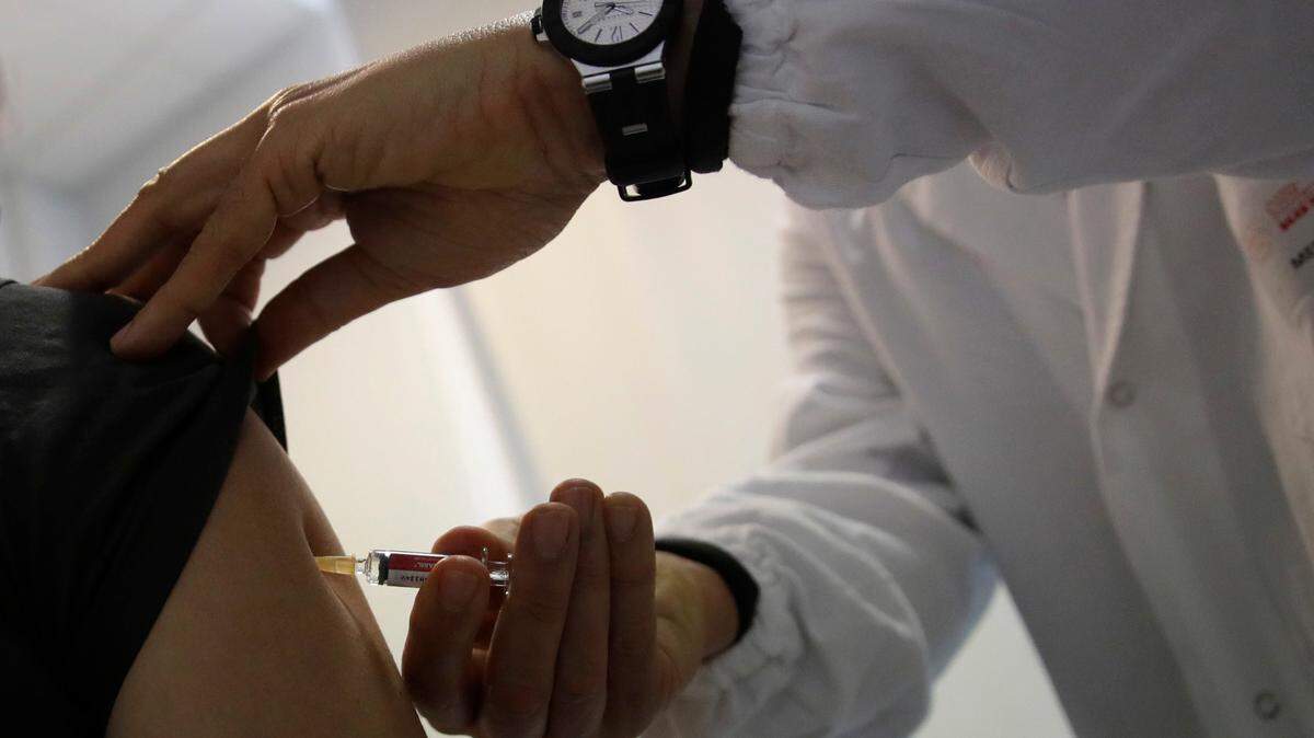 A dose of a COVID-19 vaccine is administered in this file photo.