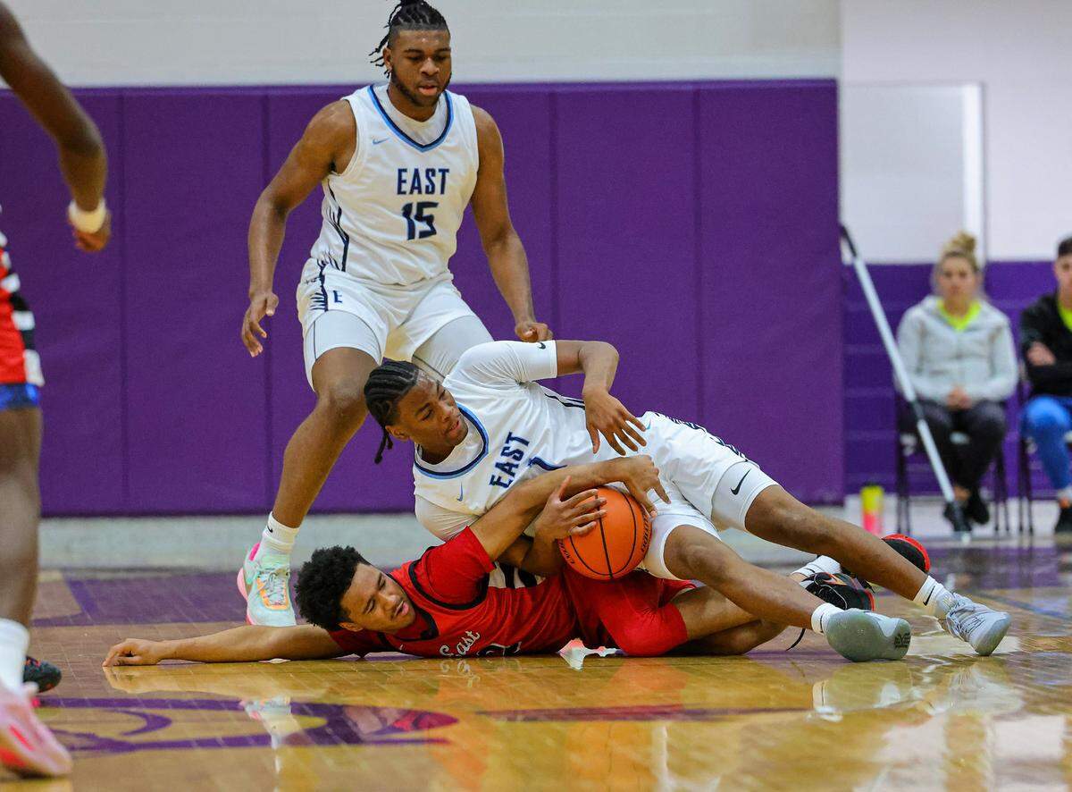 Belleville East’s Jordan Pickett battle for the ball against Rockford East in the third place game of the 38th annual Prairie Farms Collinsville Holiday Classic.