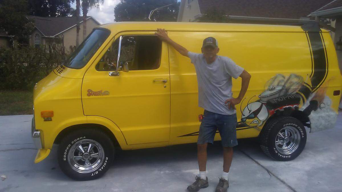 Alan Barsht poses with a 1978 Dodge van he restored after the former owner left it parked in a field for 26 years. More recently, he followed the Wild Cherry van restoration from beginning to end.