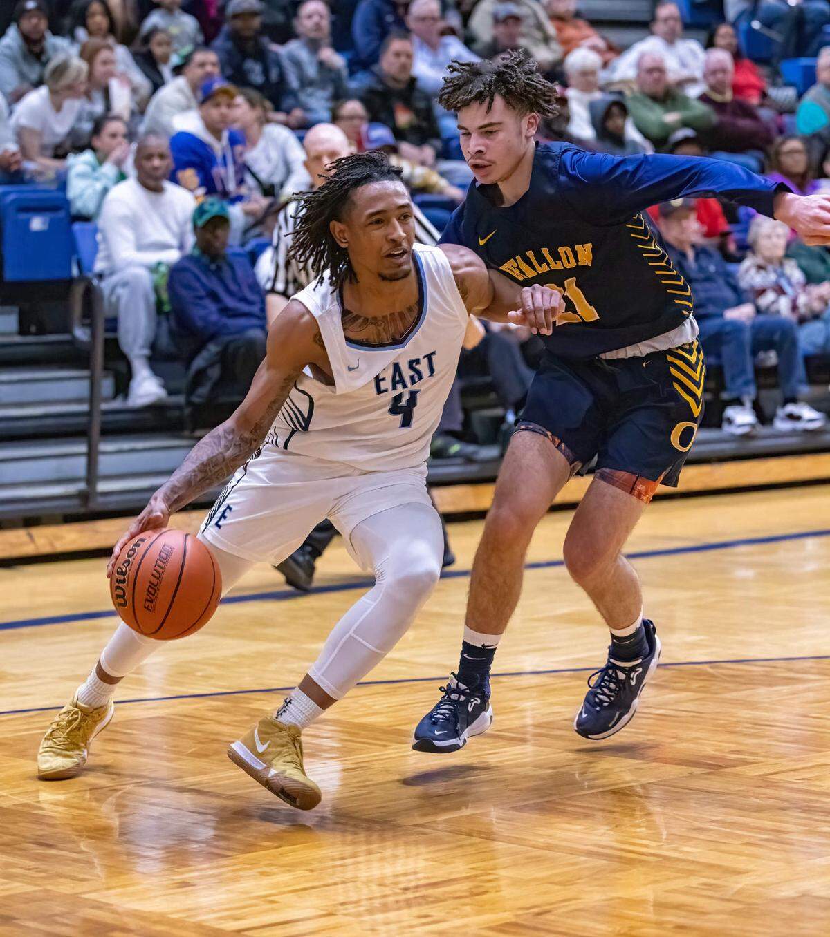 Belleville East’s Darien Singleton drives to the basket against O’Fallon’s Isaiah Camper during Friday night’s IHSA Class 4A regional championship game. The Panthers ultimately prevailed 52-50.
