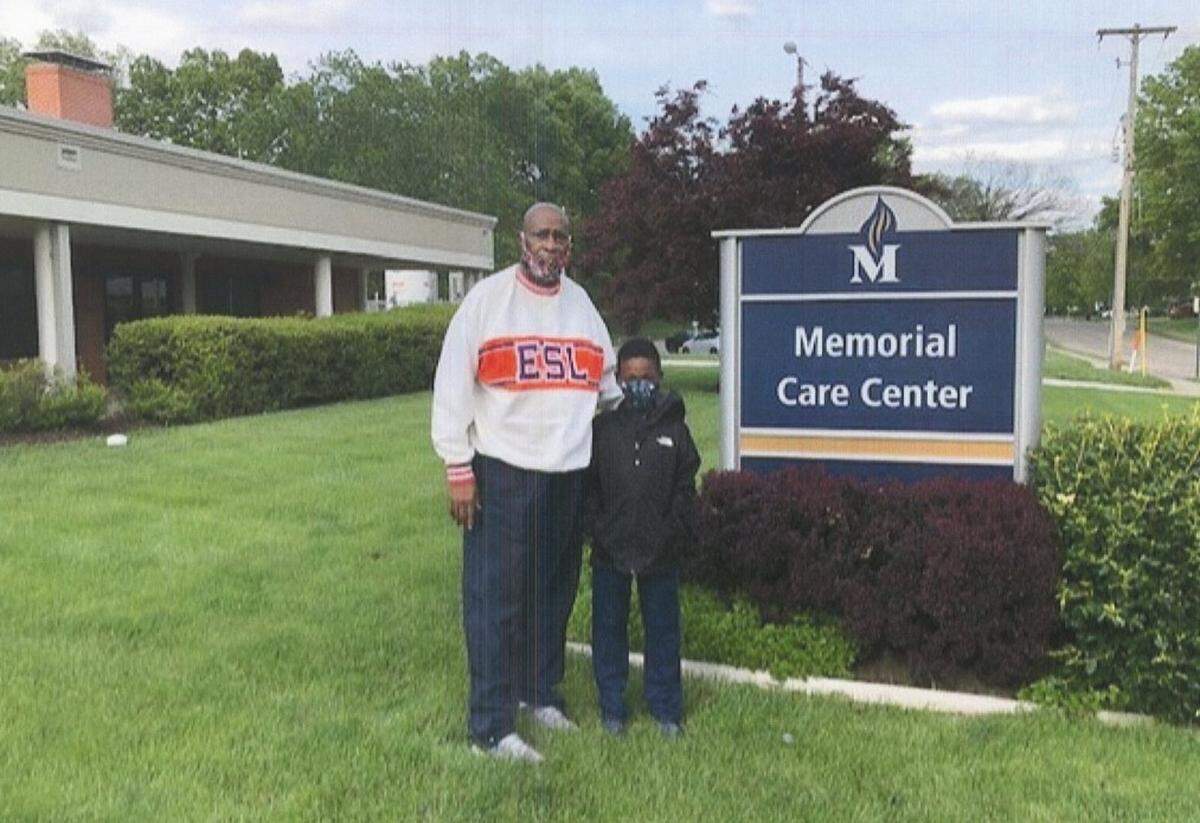 Kevin Anderson’s 8-year-old grandson, Ramon Gates Jr., accompanies him on a follow-up visit to Memorial Care Center in Belleville a week after Anderson was released.