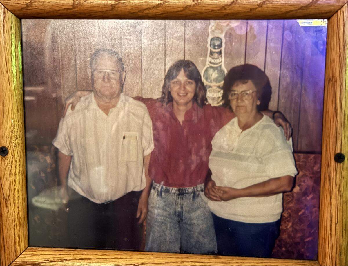 A photo of Chet and Rose with daughter Phyl (middle) hangs on the tavern's wall
