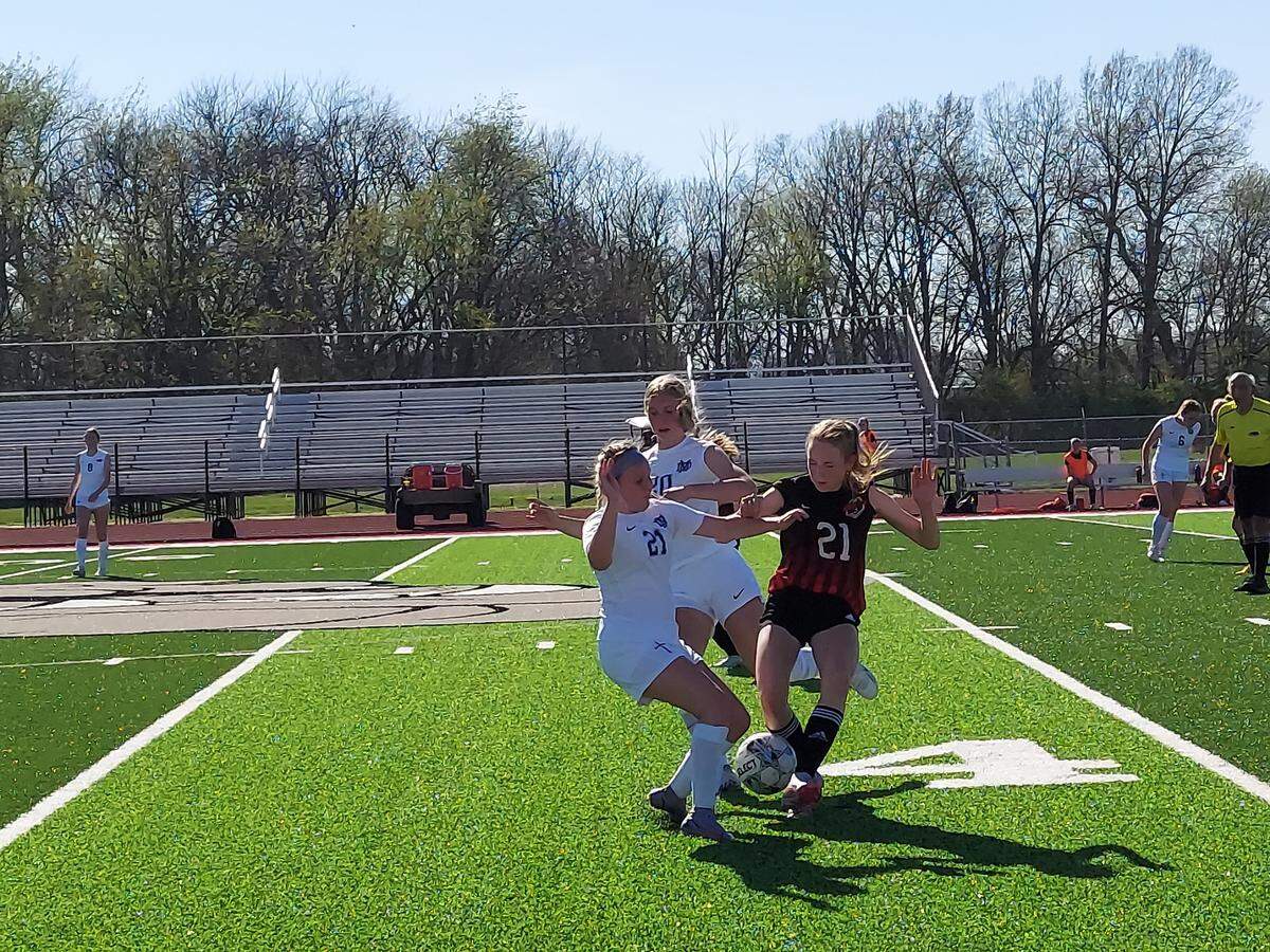 Mater Dei’s Brianna Noud and Amelia Beer battle Highland’s Alyson Pace for a loose ball just past midfield during a nonconference game Wednesday, April 12, at Highland High School. The Knights ultimately posted a 2-0 victory.