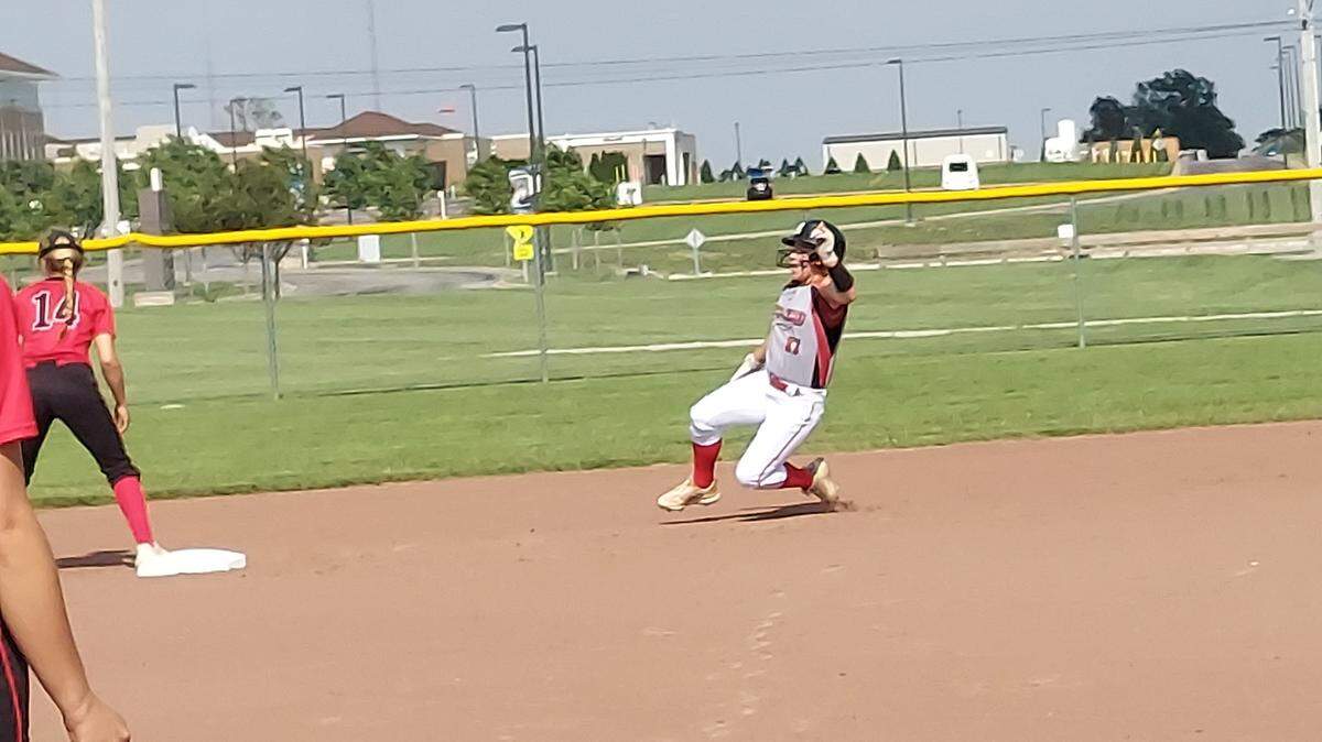 Highland’s Lucy Becker slides into second base for a double during an IHSA Class 3A regional semifinal game on Tuesday at Highland High School. Effingham defeated Highland 13-6.