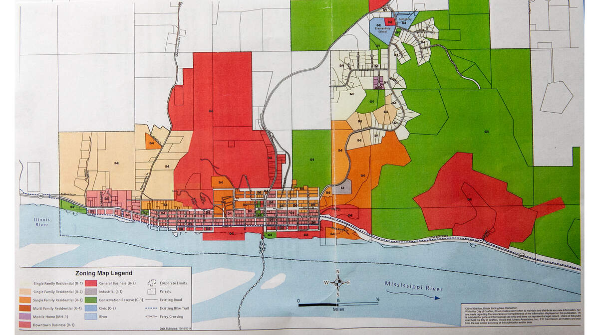 This zoning map shows Grafton Hills, center-right top (white area with subdivided lots and cul-de-sacs), in relation to the historic business district, lower left, along the riverfront.