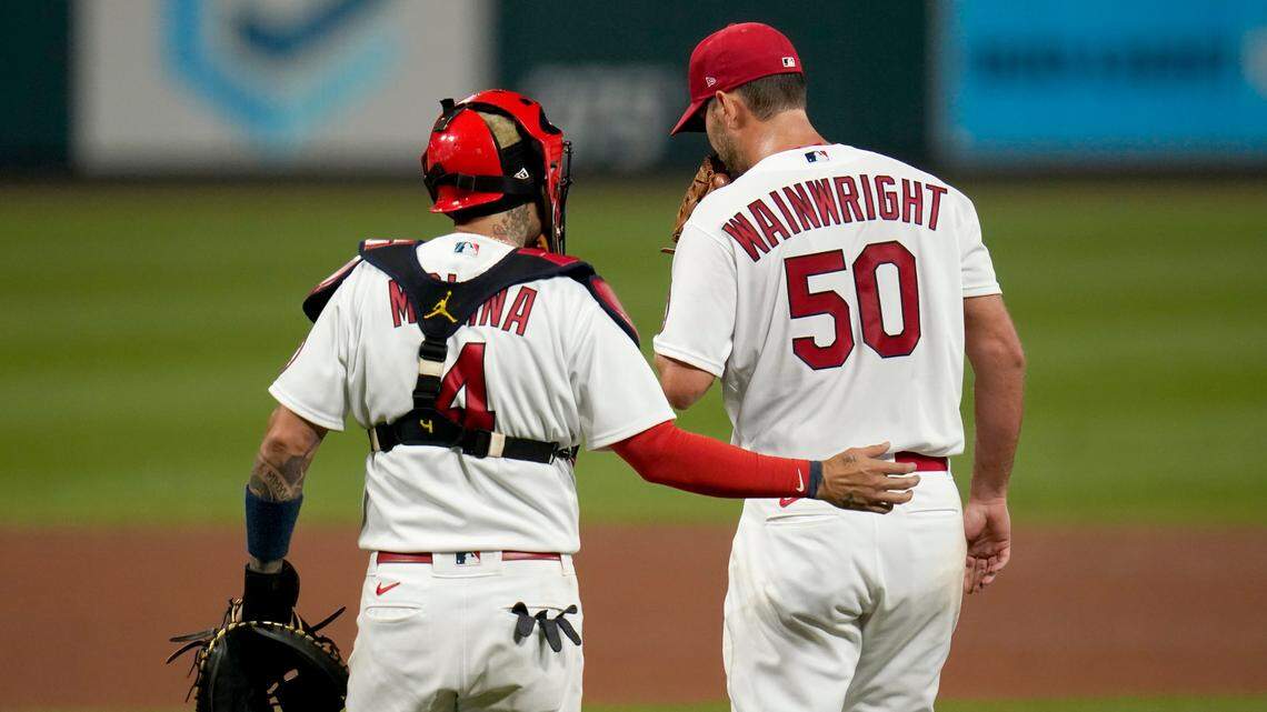 Why are the St. Louis Cardinals waiting to re-sign Molina and Wainwright?