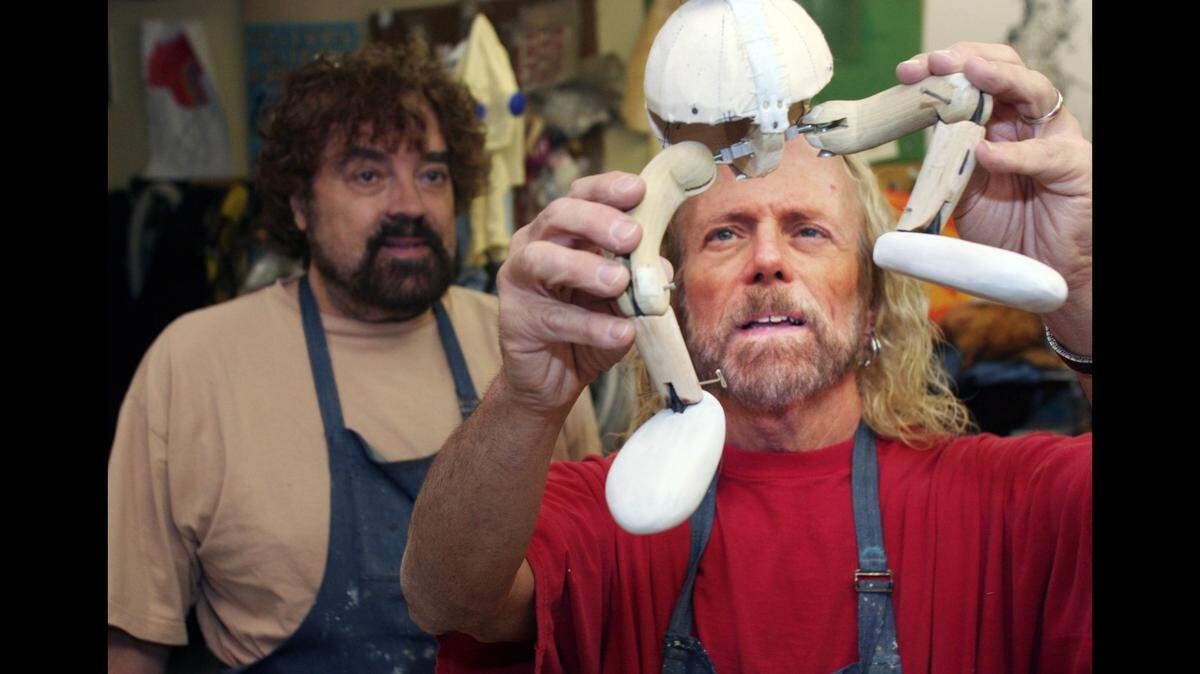 Bob Kramer, right, assembles a marionette in 2005, when the Belleville News-Democrat published a feature story on what was then called Kramer’s Marionette Theater. Pictured at left is partner Dug Feltch.