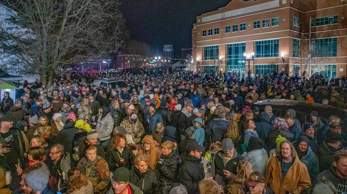 Several thousand people wait in downtown Waterloo, Illinois for the Jan. 24 Queen of Hearts drawing to benefit Saints Peter and Paul Catholic School. Since the ticket drawn was not a winner and there is a potential jackpot of $2 million, the Saints Peter and Paul Catholic School’s Queen of Hearts raffle will end on Jan. 31 when they will keep picking players until someone pulls the Queen of Hearts.