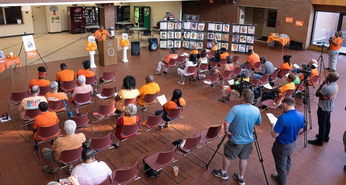 East St. Louis Police Chief Kendall Perry speaks at the National Gun Violence Awareness Day event at the East St. Louis City Hall. Each person wore the color orange. Supporters of the gun violence prevention movement wear orange to symbolize peace because it’s the color hunters wear in the woods to protect themselves and others, according to wearorange.org.